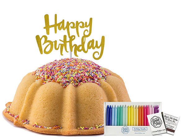 Sprinkle Birthday Cake. Paired with a mettalic gold happy birthday cake topper; package of rainbow birthday candles (20 count) and a matchbook (20 count).