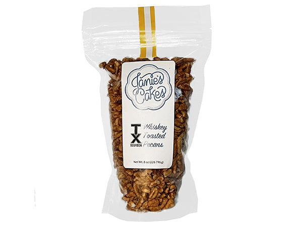 Janie's Cakes delicious whiskey toasted pecans by the resealable pouch. Lightly candied pecans.