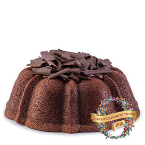 Chocolate pound cake in the shape of a bundt filled with chocolate sauce and topped with chocolate shavings. Serves 12. Featured in Oprah's Favorite Things 2016. Packaged in our signature yellow and white striped gift box with a blue bow.