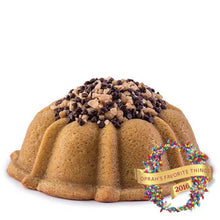 Load image into Gallery viewer, Coffee pound cake in the shape of a bundt filled with coffee toffee buttercream and topped with chocolate chips and toffee. Serves 12. Oprah&#39;s Favorite Things 2016. Packaged in our signature yellow and white striped gift box with a blue bow.