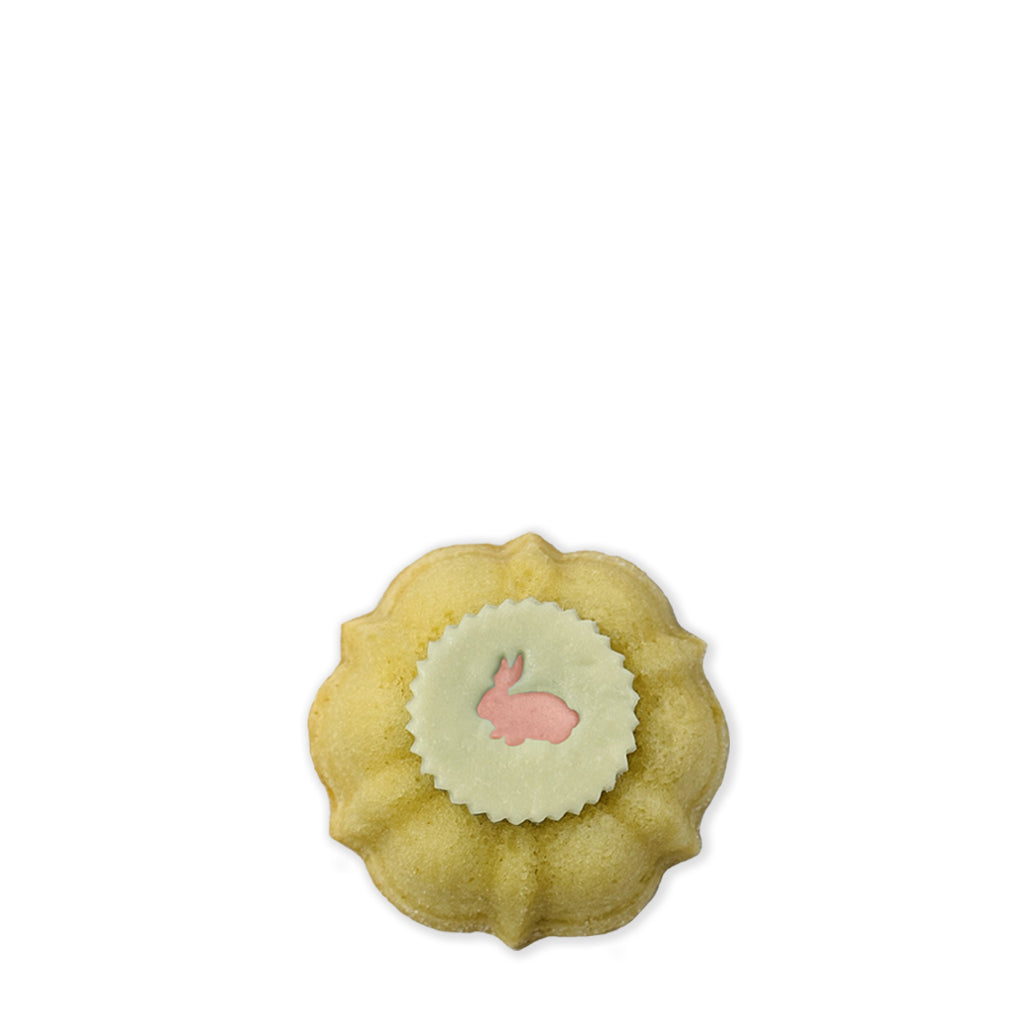Pastel pink Easter Bunny Medallion Petite Jane! Vanilla pound cake filled with vanilla buttercream topped with white chocolate Easter bunny medallions.