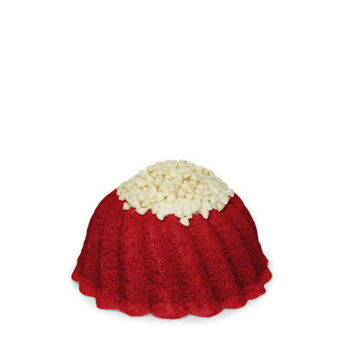 Red Velvet pound cake in the shape of a bundt filled with cream cheese buttercream and topped with white chocolate chips. Serves 6. 