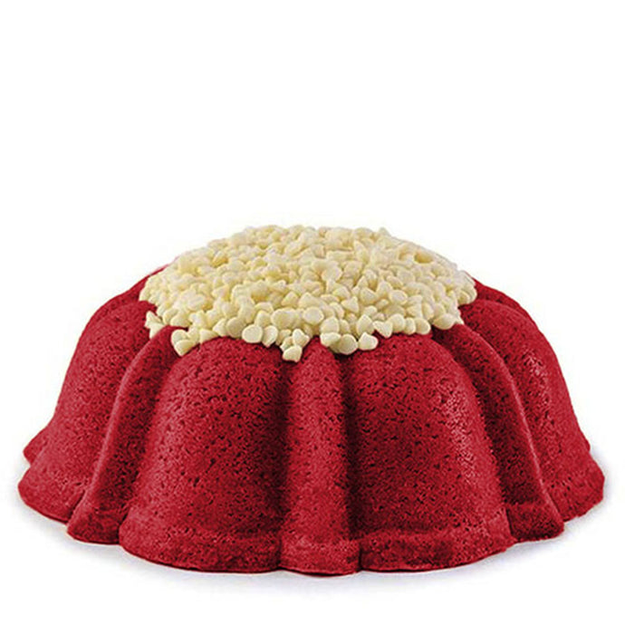 Red Velvet pound cake in the shape of a bundt filled with cream cheese buttercream and topped with white chocolate chips. Serves 12. 