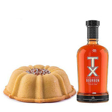 Load image into Gallery viewer, Vanilla pound cake in the shape of a bundt infused with TX Bourbon filled with whiskey toasted pecans and topped with a whiskey glaze. Serves 12. Packaged in our signature yellow and white striped gift box with a blue bow. 