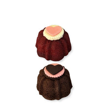 Load image into Gallery viewer, valentine bundt cake 2 pack topped with chocolate medallions. Two pack includes a chocolate cake and red velvet cake.