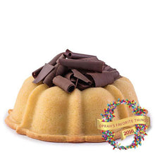 Load image into Gallery viewer, Vanilla pound cake in the shape of a bundt filled with chocolate sauce and topped with chocolate shavings. Serves 12. Featured in Oprah&#39;s Favorite Things 2016. Packaged in our signature yellow and white striped gift box with a blue bow.