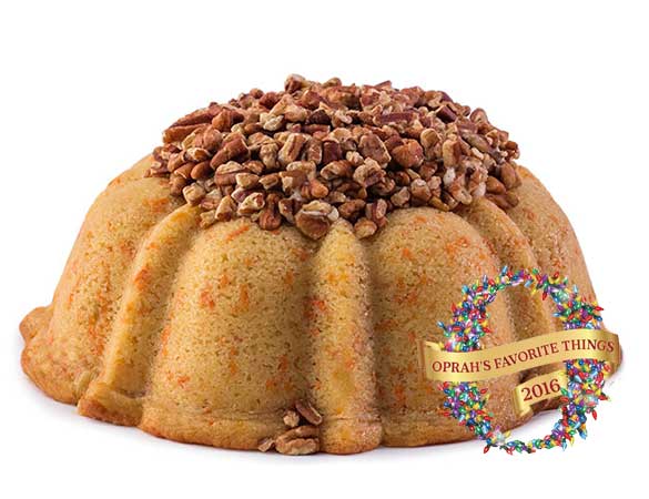 Carrot and cinnamon pound cake in the shape of a bundt filled with cinnamon cream cheese buttercream and topped with toasted pecans. serves 12. Oprah's Favorite Things. Packaged in our signature yellow and white striped gift box with a blue bow.