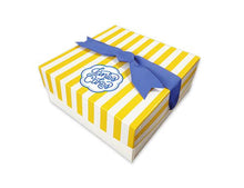 Load image into Gallery viewer, Every Janie&#39;s Cakes comes backaged in our signature yellow and white striped gift box with a blue bow.