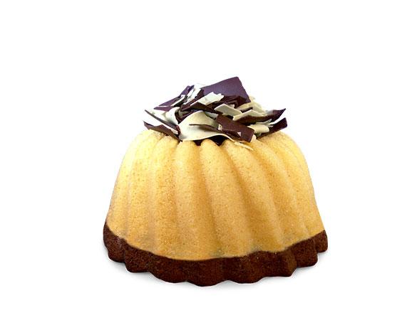 A slice of marbled vanilla and chocolate pound cake in the shape of a bundt filled with chocolate sauce and topped with dark and white chocolate shavings. Serves 6. Packaged in our signature yellow and white striped gift box with a blue bow.