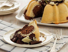 Load image into Gallery viewer, A slice of marbled vanilla and chocolate pound cake in the shape of a bundt filled with chocolate sauce and topped with dark and white chocolate shavings. Serves 12. Oprah&#39;s Favorite Things. Packaged in our signature yellow and white striped gift box with a blue bow.
