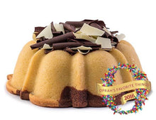 Load image into Gallery viewer, Marbled vanilla and chocolate pound cake in the shape of a bundt filled with chocolate sauce and topped with dark and white chocolate shavings. Serves 12. Oprah&#39;s Favorite Things. Packaged in our signature yellow and white striped gift box with a blue bow.