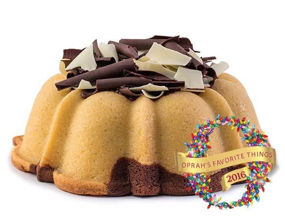 Marbled vanilla and chocolate pound cake in the shape of a bundt filled with chocolate sauce and topped with dark and white chocolate shavings. Serves 12. Oprah's Favorite Things. Packaged in our signature yellow and white striped gift box with a blue bow.