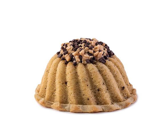Coffee pound cake in the shape of a bundt filled with coffee toffee buttercream and topped with chocolate chips and toffee. Serves 6. Packaged in our signature yellow and white striped gift box with a blue bow.