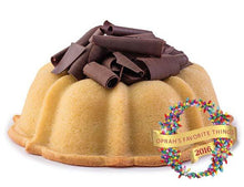 Load image into Gallery viewer, Vanilla pound cake in the shape of a bundt filled with chocolate sauce and topped with chocolate shavings. Serves 12. Featured in Oprah&#39;s Favorite Things. Packaged in our signature yellow and white striped gift box with a blue bow.